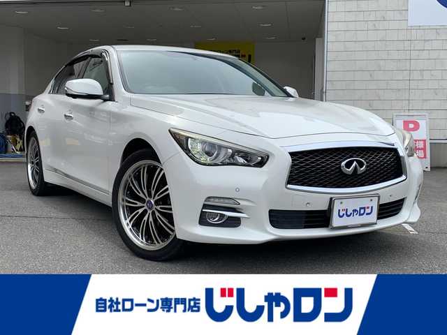 日産 スカイライン 200GT－t タイプP 佐賀県 2015(平27)年 12万km クリスタルホワイトパール (株)IDOMが運営する【じしゃロン佐賀店】の自社ローン専用車両になりますこちらは現金またはオートローンご利用時の価格です。自社ローンご希望の方は別途その旨お申付け下さい/プッシュスタート/純正ナビ/　・AM/FM/　・CD/DVD/　・TV（フルセグ）/　・Bluetooth/　・USB/AUX/iPod/アラウンドビューモニター/ビルトインETC/クルーズコントロール/コーナーセンサー/横滑り防止装置/アイドリングストップ/前席パワーシート/　　　　 シートヒーター/レザーシート/メモリーシート/電動格納ミラー
