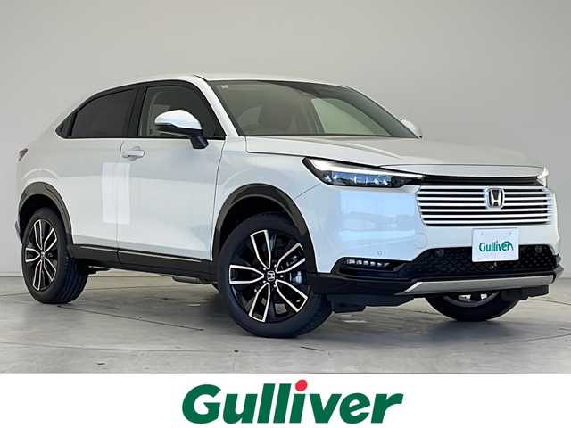 ホンダ ヴェゼル ハイブリッド e:HEV Z 愛知県 2025(令7)年 0.1万km未満 プラチナホワイトパール 登録済未使用車/衝突被害軽減ブレーキ/純正9インチディスプレイオーディオ（ナビあり）/レーダークルーズコントロール/シートヒーター/フルセグTV/Bluetooth/バックカメラ/電動リアゲート/コーナーセンサー/純正アルミホイール/ブラインドスポットモニター/LEDヘッドライト/パドルシフト/ステアリングヒーター/ETC2.0/オートマチックハイビーム/置くだけ充電器/ステアリングスイッチ/スマートキー/プッシュスタート
