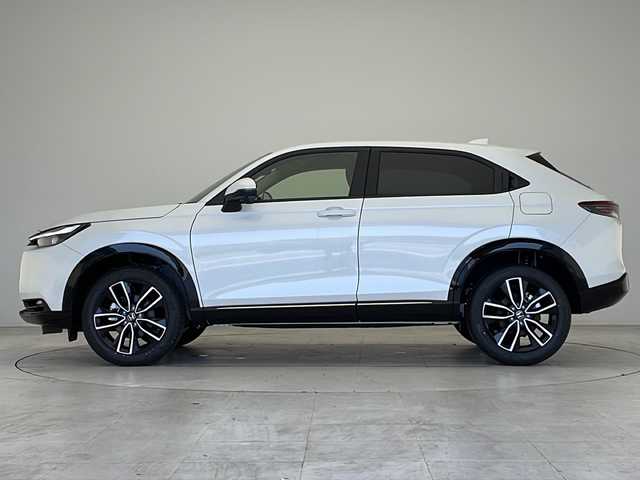 ホンダ ヴェゼル ハイブリッド e:HEV Z 愛知県 2025(令7)年 0.1万km未満 プラチナホワイトパール 登録済未使用車/衝突被害軽減ブレーキ/純正9インチディスプレイオーディオ（ナビあり）/レーダークルーズコントロール/シートヒーター/フルセグTV/Bluetooth/バックカメラ/電動リアゲート/コーナーセンサー/純正アルミホイール/ブラインドスポットモニター/LEDヘッドライト/パドルシフト/ステアリングヒーター/ETC2.0/オートマチックハイビーム/置くだけ充電器/ステアリングスイッチ/スマートキー/プッシュスタート