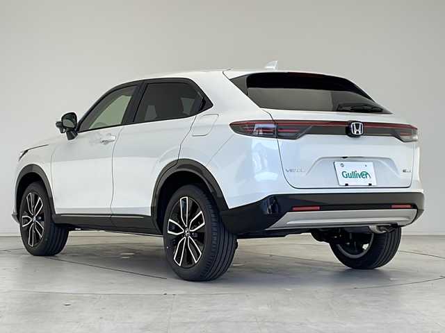 ホンダ ヴェゼル ハイブリッド e:HEV Z 愛知県 2025(令7)年 0.1万km未満 プラチナホワイトパール 登録済未使用車/衝突被害軽減ブレーキ/純正9インチディスプレイオーディオ（ナビあり）/レーダークルーズコントロール/シートヒーター/フルセグTV/Bluetooth/バックカメラ/電動リアゲート/コーナーセンサー/純正アルミホイール/ブラインドスポットモニター/LEDヘッドライト/パドルシフト/ステアリングヒーター/ETC2.0/オートマチックハイビーム/置くだけ充電器/ステアリングスイッチ/スマートキー/プッシュスタート