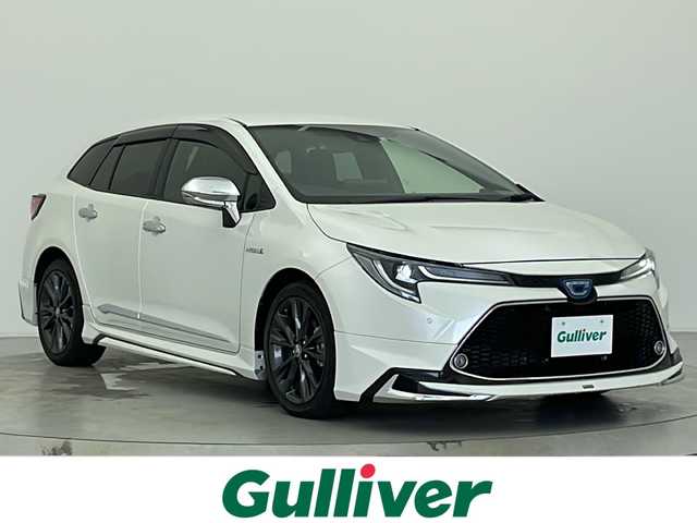 トヨタ カローラツーリング ハイブリッド ダブルバイビー 宮城県 2020(令2)年 2.8万km ホワイトパールクリスタルシャイン 純正ディスプレイオーディオ/(AM/FM/USB/BT/Miracast)/バックカメラ/ETC2.0/TVキャンセラー/モデリスタエアロ/レーダークルーズコントロール/ハーフレザー/シートヒーター/ステアリングヒーター/SOSスイッチ/プッシュスタート/スマートキー/スペアキー/オートライト/オートマチックハイビーム/LEDヘッドライト/フォグランプ/純正フロアマット/純正17インチアルミホイール