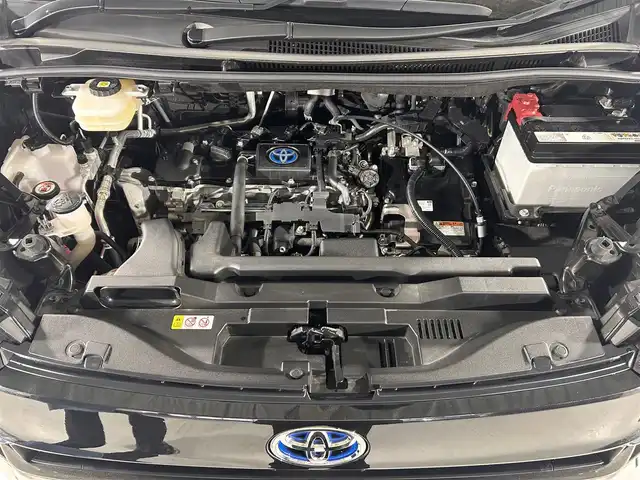 トヨタ ヴォクシー ハイブリッド S－Z 熊本県 2023(令5)年 2.9万km グリッターブラックガラスフレーク 純正10.5インチナビ/CD/DVD/フルセグTV/Bluetooth/純正14インチフリップダウンモニター/両側パワースライドドア/トヨタセーフティセンス/プリクラッシュセーフティ/レーンディパーチャーアラート/クリアランスソナー/パーキングサポートブレーキ/ロードサインアシスト/プロアクティブドライビングアシスト/快適利便パッケージ/ユニバーサルステップ/ハーフレザーシート/シートヒーター/オットマン/１００V充電/追従付きクルーズコントロール/オートハイビーム/前後ドライブレコーダー/ビルトインETC2.0/フロアマット/純正ドアバイザー/純正17インチアルミホイール