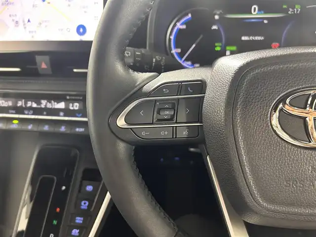 トヨタ ヴォクシー ハイブリッド S－Z 熊本県 2023(令5)年 2.9万km グリッターブラックガラスフレーク 純正10.5インチナビ/CD/DVD/フルセグTV/Bluetooth/純正14インチフリップダウンモニター/両側パワースライドドア/トヨタセーフティセンス/プリクラッシュセーフティ/レーンディパーチャーアラート/クリアランスソナー/パーキングサポートブレーキ/ロードサインアシスト/プロアクティブドライビングアシスト/快適利便パッケージ/ユニバーサルステップ/ハーフレザーシート/シートヒーター/オットマン/１００V充電/追従付きクルーズコントロール/オートハイビーム/前後ドライブレコーダー/ビルトインETC2.0/フロアマット/純正ドアバイザー/純正17インチアルミホイール