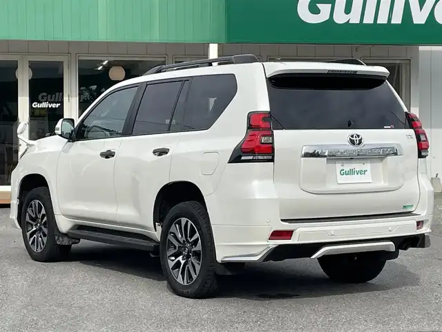 トヨタ ランドクルーザー プラド TX Lパッケージ 千葉県 2023(令5)年 2.7万km ホワイトパールクリスタルシャイン モデリスタエアロ(F/R)/サンルーフ/黒レザーシート/ALPINEビッグX11インチSDナビ【XF11NX】/・CD/DVD/MSV/Bluetooth/フルセグTV/ALPINEデジタルインナーミラー/前席パワーシート/前席シートヒーター/前席シートベンチレーション/トヨタセーフティーセンス/・プリクラッシュセーフティー/・レーンキープアシスト/・ロードサインアシスト/・オートマチックハイビーム/・アダプティブクルーズコントロール/電動格納サードシート/バックカメラ/スマートキー/前後コーナーセンサー/ルーフレール/ウッドコンビステアリング/サイドステップ/純正LEDヘッドライト/フォグランプ/ETC/社外ドライブレコーダー/サイド＆カーテンエアバッグ