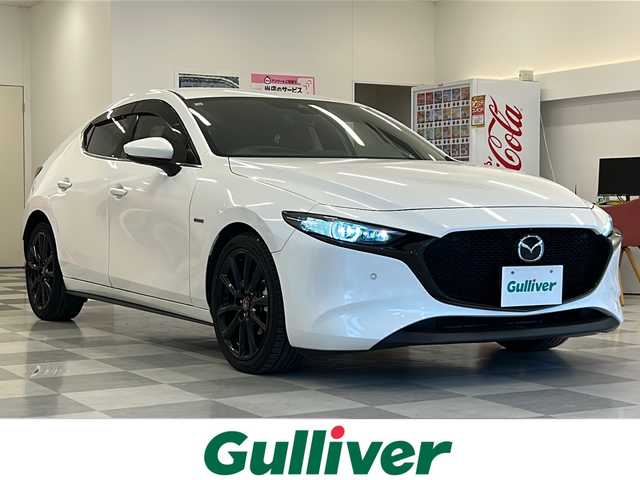 マツダ マツダ３ファストバック 15S 100周年特別記念車 岐阜県 2020(令2)年 6.8万km スノーフレイクホワイトパールマイカ BOSEプレミアムサウンド/マツダ純正ナビゲーション/マツダ・レーダー・クルーズ・コントロール(MRCC)/フルセグテレビ/アラウンドビューカメラ/Bluetooth/AppleCarPlay/CD・DVD再生/前後ドライブレコーダー/ETC/革シート/シートヒーター/パワーシート/純正フロアマット/オートライト/オートマチックハイビーム/LEDヘッドライト/純正アルミホイール