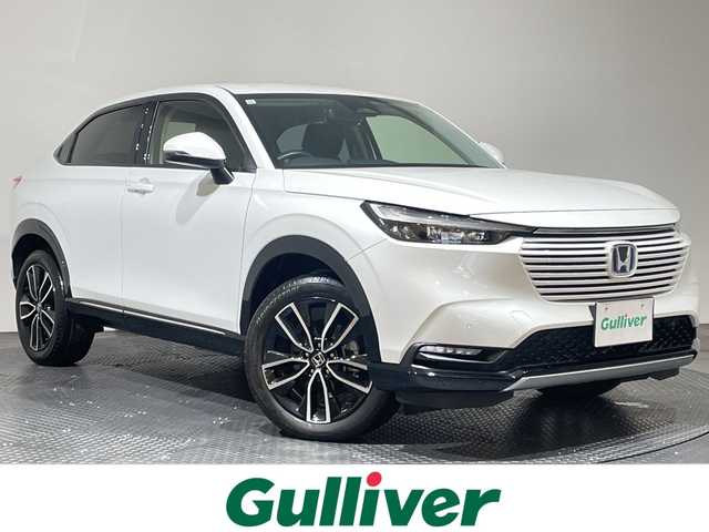 ホンダ ヴェゼル ハイブリッド e:HEV Z 愛媛県 2023(令5)年 1.7万km プラチナホワイトパール 純正9インチナビ/Bluetooth/フルセグ/USB/バックカメラ/レーダークルーズコントロール/衝突被害軽減ブレーキ/レーンキープアシスト/前後コーナーセンサー/ブラインドスポットモニター/ダウンヒルアシストコントロール/ミラー型ドライブレコーダー/LEDヘッドライト/オートマチックハイビーム/オートライト/ワイヤレス充電/シートヒーター/ステアリングヒーター/ETC/スペアキー/保証書/取扱説明書