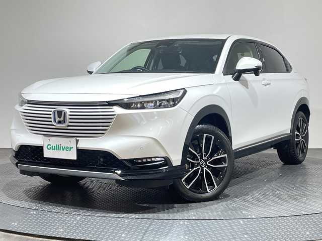 ホンダ ヴェゼル ハイブリッド e:HEV Z 愛媛県 2023(令5)年 1.7万km プラチナホワイトパール 純正9インチナビ/Bluetooth/フルセグ/USB/バックカメラ/レーダークルーズコントロール/衝突被害軽減ブレーキ/レーンキープアシスト/前後コーナーセンサー/ブラインドスポットモニター/ダウンヒルアシストコントロール/ミラー型ドライブレコーダー/LEDヘッドライト/オートマチックハイビーム/オートライト/ワイヤレス充電/シートヒーター/ステアリングヒーター/ETC/スペアキー/保証書/取扱説明書
