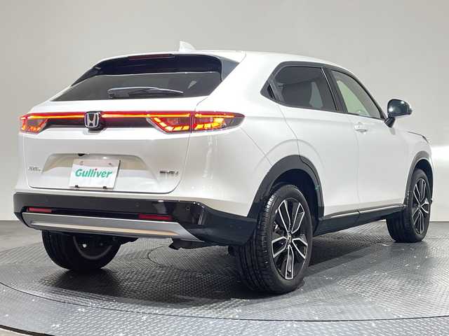 ホンダ ヴェゼル ハイブリッド e:HEV Z 愛媛県 2023(令5)年 1.7万km プラチナホワイトパール 純正9インチナビ/Bluetooth/フルセグ/USB/バックカメラ/レーダークルーズコントロール/衝突被害軽減ブレーキ/レーンキープアシスト/前後コーナーセンサー/ブラインドスポットモニター/ダウンヒルアシストコントロール/ミラー型ドライブレコーダー/LEDヘッドライト/オートマチックハイビーム/オートライト/ワイヤレス充電/シートヒーター/ステアリングヒーター/ETC/スペアキー/保証書/取扱説明書