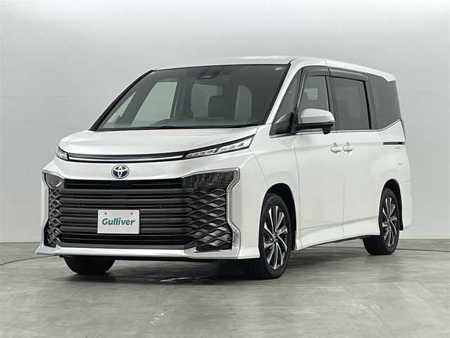 トヨタ ヴォクシー ハイブリッド S－Z 福島県 2023(令5)年 0.6万km ホワイトパールクリスタルシャイン トヨタセーフティセンス/・衝突被害軽減ブレーキ/・交差点事故防止/・アクティブアクティブ操舵機能/・プロアクティブドライビング/・レーダークルーズコントロール/・レーンキープアシスト/・オートマチックハイビーム/純正8インチディスプレイオーディオ/・BT/USB/Miracast/FM/AM/・ETC/・バックカメラ/・前後ドライブレコーダー/電子ブレーキホールド/・ブレーキホールド/3列目シート/・ウォークスルー/・2列目ロールサンシェード/両側パワースライドドア/革巻きステアリング/・ステアリングリモコン/ハーフレザーシート/・D+N席シートヒーター/USB充電ポート/プッシュスタート/・スマートキー/LEDヘッドライト/・オートライト/・ヘッドライトレベライザー/純正フロアマット/純正ドアバイザー/純正17インチAW