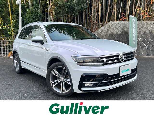 フォルクスワーゲン ティグアン TSI Rライン 京都府 2018(平30)年 4.1万km 白 純正メーカーナビ/・DVD/CD/BT/・フルセグテレビ/ETC2.0/全周囲カメラ/バックカメラ/衝突軽減ブレーキ/レーンキープアシスト/クルーズコントロール/革巻きステアリング/ステアリングスイッチ/パドルシフト/シートヒーター（全席）/ルーフレール/前後コーナーセンサー/LEDヘッドライト/スマートキー×2/純正19インチアルミホイール/純正フロアマット/取扱説明書/ナビ取扱説明書/保証書