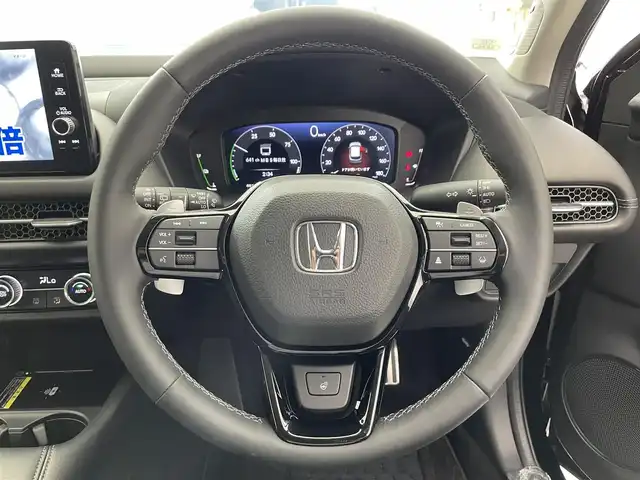 ホンダ ＺＲ－Ｖ ハイブリッド e:HEV Z 滋賀県 2024(令6)年 1.2万km クリスタルブラックパール 禁煙車/純正9型ナビ/【フルセグTV/Bluetooth/USB】/前後ドラレコ/ETC2.0/マルチビューカメラ/BOSEサウンド/ホンダセンシング/●衝突軽減ブレーキ/●先行車発進お知らせ機能/●歩行者事故低減ステアリング/●路外逸脱抑制機能/●標識認識機能/●渋滞追従機能付アダプティブクルーズコントロール/●車線維持支援システム/●トラフィックジャムアシスト/●ブラインドスポットインフォメーション/●誤発進抑制機能/●後方誤発進抑制機能/●近距離衝突軽減ブレーキ/●パーキングセンサーシステム/●後退出庫サポート/●オートハイビーム/パワーシート/ドライビングポジションシステム/シートヒーター/ステアリングヒーター/ワイヤレス充電/ハンズフリーパワーバックドア/LEDヘッドライト/オートブレーキホールド
