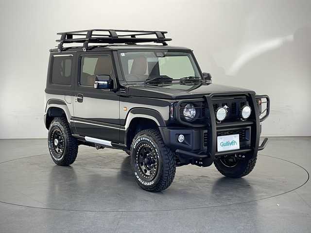 スズキ ジムニー XC 長野県 2024(令6)年 0.1万km未満 ブルーイッシュブラックパール3 4WD/社外メモリナビ（型番：MDV-D503)/(フルセグ/DVD/CD/SD/USB/FM/AM)/大型グリルガード/LEDフォグ×2個/ルーフラック/リアラダー/1.5インチリフトアップキット（純正車内積載）/ブラウンキルティングレザーシート/MERAL ROCK ピートロング16インチホイール/TOYO OPEN COUNTRY RT(185/85R16)/シートヒーター（前席）/クルーズコントロール（追従なし）/レーンキープアシスト/衝突被害軽減システム/オートマチックハイビーム/LEDヘッドライト/オートライト/スマートキー/保証書/取扱説明書