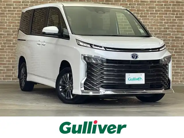 トヨタ ヴォクシー ハイブリッド S－G 岩手県 2022(令4)年 2.1万km ホワイトパールクリスタルシャイン ４WD/ワンオーナー/両側パワースライドドア/アイドリングストップ/衝突被害軽減システム/クルーズコントロール/ETC2.0/ドライブレコーダー/ユニバーサルステップ/横滑り防止装置/フルセグTV/純正ナビ/バックカメラ/シートヒーター/コーナーセンサー/レーンアシスト/純正フロアマット/純正アルミホイール16インチ/純正LEDヘッドライト/オートライト/オートマチックハイビーム