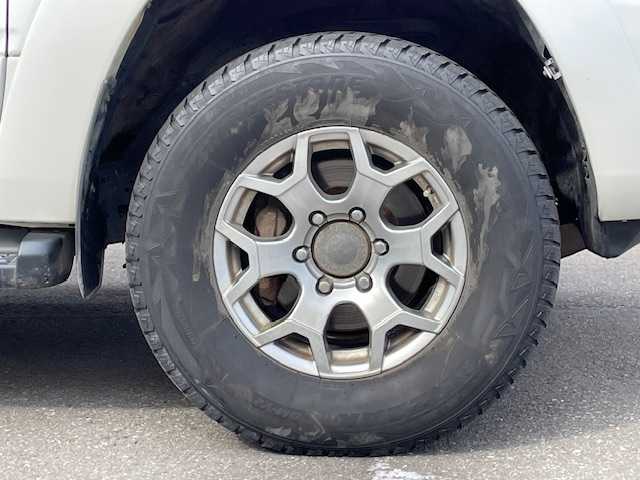 トヨタ ハイラックス サーフ SSR－X 青森県 2005(平17)年 18.3万km ホワイトパールクリスタルシャイン /４WD/社外ナビ/　（DVD/Bｔ視聴可）/社外バックカメラ/社外16インチアルミホイール/ランプ付きサイドステップ/純正ドアバイザー/純正フロアマット/バックドア・イージークローザー/リア7面プライバシーガラス/オートライト/Wエアバッグ/ABS/取説