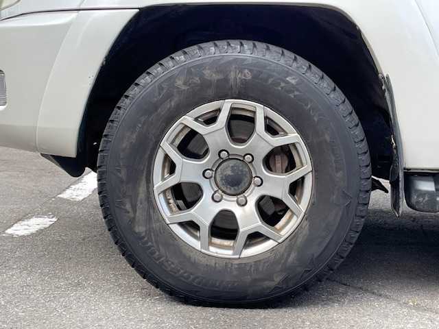 トヨタ ハイラックス サーフ SSR－X 青森県 2005(平17)年 18.3万km ホワイトパールクリスタルシャイン /４WD/社外ナビ/　（DVD/Bｔ視聴可）/社外バックカメラ/社外16インチアルミホイール/ランプ付きサイドステップ/純正ドアバイザー/純正フロアマット/バックドア・イージークローザー/リア7面プライバシーガラス/オートライト/Wエアバッグ/ABS/取説