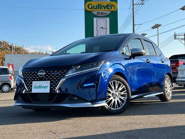 日産 ノート オーテック 山口県 2021(令3)年 5.3万km オーロラフレアブルーパール AUTECH専用装備/フロントグリル/シルバーフロントプロテクター/サイドシルプロテクター/シルバーリヤプロテクター/ダークウッド調フィニッシャー/合皮アームレスト/フロントセンターアームレスト/リヤセンターアームレスト/専用ブラックレザレットシート刺繍/専用ブラック本革巻ステアリング/AUTECHエンブレム/純正メモリナビ/（AM/FM/CD/DVD/USB/Bluetooth）/バックカメラ/ハーフレザー/純正フロアマット/ドライブレコーダー（DH5-D）/LEDヘッドライト/フォグランプ