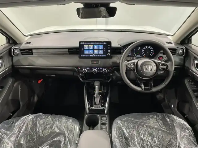 ホンダ ヴェゼル ハイブリッド e:HEV Z 愛知県 2025(令7)年 0.1万km未満 プラチナホワイトパール 登録済未使用車/Honda CONNECTディスプレー/（Bluetooth/フルセグTV/CarPlay/AM/FM)/ETC2.0車載器/ワイヤレス充電器/ホンダセンシング　/　　-衝突軽減ブレーキ（CMBS)/　　-路線逸脱抑制機能/　　-アダプティブクルーズコントロール/　　-先行車発進お知らせ機能/　　-標識認識機能/　　-オートハイビーム/電動バックドア　/ＬＥＤヘッドライト　/シートヒーター　/ステアリングヒーター/コーナーセンサー/ダウンヒルアシスト/バックカメラ