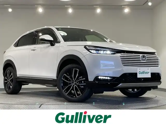 ホンダ ヴェゼル ハイブリッド e:HEV Z 愛知県 2025(令7)年 0.1万km未満 プラチナホワイトパール 登録済未使用車/Honda CONNECTディスプレー/（Bluetooth/フルセグTV/CarPlay/AM/FM)/ETC2.0車載器/ワイヤレス充電器/ホンダセンシング　/　　-衝突軽減ブレーキ（CMBS)/　　-路線逸脱抑制機能/　　-アダプティブクルーズコントロール/　　-先行車発進お知らせ機能/　　-標識認識機能/　　-オートハイビーム/電動バックドア　/ＬＥＤヘッドライト　/シートヒーター　/ステアリングヒーター/コーナーセンサー/ダウンヒルアシスト/バックカメラ