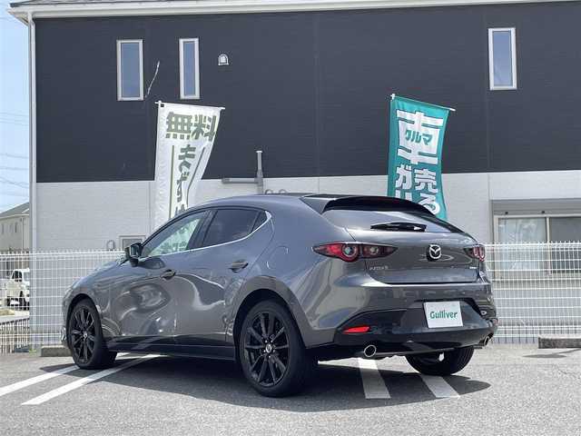 マツダ マツダ３ファストバック 15S ブラックトーンED 三重県 2023(令5)年 1.3万km マシーングレープレミアムM 登録時12217Km/ワンオーナー/ナビ/（AM・FM・CD・DVD・Bluetooth・HDMI・USB）/フルセグTV/ドラレコ/クルーズコントロール（追従あり）/バッグカメラ　/パドルシフト　/ＭＴモード付ＡＴ　/スペアキー　/ＬＥＤオートライト　/ＨＵＤ（ヘッドアップディスプレイ）/クリアランスソナー　/アイドリングストップ/コーナーセンサー　/車線逸脱警報　/横すべり防止/衝突被害軽減/電動格納ミラー/スポーツモード　/オートホールド/スマートブレーキサポート/取説/保証書