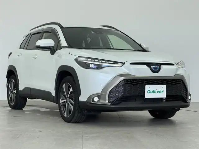 トヨタ カローラ クロス ハイブリッド Z 愛知県 2022(令4)年 3.1万km プラチナホワイトパールマイカ 純正9インチメモリナビ/（CD/DVD/BT/フルセグTV）/バックカメラ/電動リアゲート/ハーフレザー/シートヒーター/パワーシート/トヨタセーフティセンス/・レーンキープアシスト/・衝突被害軽減システム/・クリアランスソナー/・パーキングサポートブレーキ/・標識認識システム/ドアバイザー/EVモード/ドライブモード/オートブレーキホールド/純正18インチAW/純正LEDヘッドライト