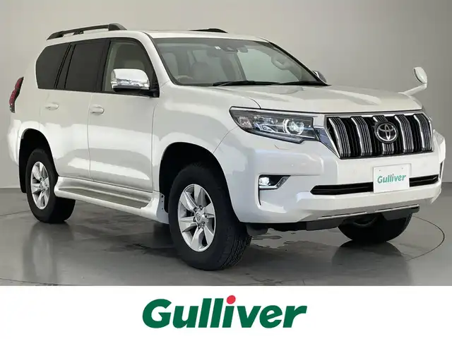 トヨタ ランドクルーザー プラド TX Lパッケージ 大阪府 2023(令5)年 4.2万km ホワイトパールクリスタルシャイン 純正９型ナビ　フルセグＴＶ　Ｂｌｕｅｔｏｏｔｈ　ムーンルーフ　ベージュレザー　７人乗　ルーフレール　バックカメラ　プッシュスタート　パワーシート　シートヒーター　エアシート　ＥＴＣ　衝突軽減　禁煙車
