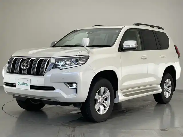 トヨタ ランドクルーザー プラド TX Lパッケージ 大阪府 2023(令5)年 4.2万km ホワイトパールクリスタルシャイン 純正９型ナビ　フルセグＴＶ　Ｂｌｕｅｔｏｏｔｈ　ムーンルーフ　ベージュレザー　７人乗　ルーフレール　バックカメラ　プッシュスタート　パワーシート　シートヒーター　エアシート　ＥＴＣ　衝突軽減　禁煙車