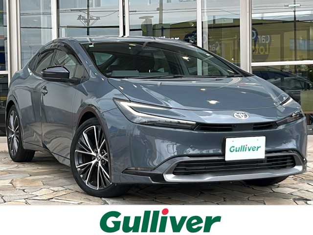 トヨタ プリウス Z 静岡県 2023(令5)年 1.5万km グレー トヨタセーフティセンス/・プリクラッシュセーフティ/・レーンキープアシスト/・アクティブクルーズコントロール/・ロードサインアシスト/・ブラインドスポットモニター/・プロアクティブドライビングアシスト/・パーキングサポートブレーキ/純正メーカーディスプレイオーディオ/・ナビ機能/・フルセグTV/・ラジオ/Bluetooth/ミラーキャスト/主要装備/・シートヒーター/・エアシート/・ハンドルヒーター/・ビルトインETC2.0/・パワーバックドア/・AC100V/・全方位カメラ/・置くだけ充電/・レザーシート/・レザーハンドル/・オートライト/・オートハイビーム/・オートホールド/・ステアリングリモコン/・パワーシート/・デジタルインナーミラー/・プッシュスタート/・スマートキー