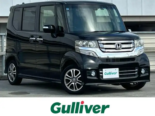 ホンダ Ｎ ＢＯＸ カスタム SSパッケージ 静岡県 2015(平27)年 6.9万km スマートブラック 両側電動スライドドア/あんしんパッケージ/ワンセグTV/GATHERSディスプレイオーディオ/バックカメラ/BLUETOOTH/ディスチャージヘッドライト(オートライトコントロール機構付)/オートリトラミラー/純正14インチアルミホイール/スーパーＵＶカットフロントドアガラス/ＩＲカットフロントウィンドウ・フロントドアガラス/リア席サンシェード/ワンタッチウィンカー/クロームメッキ・インナードアハンドル（フロント）/シルバーリング塗装ドリンクホルダー/クロームメッキ・シフトノブボタン/エアコンアウトレットノブ／リング/ナビ装着用スペシャルパッケージ/純正フロアマット