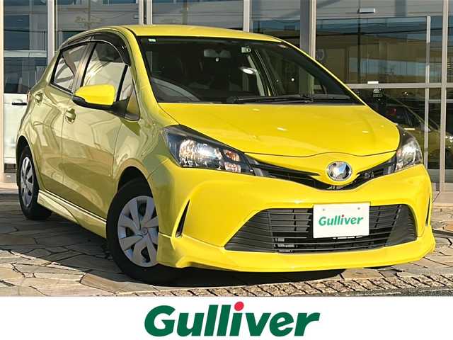 トヨタ ヴィッツ F 静岡県 2015(平27)年 2.9万km 黄 純正ナビ/（AM FM CD DVD SD ワンセグテレビ　Bluetooth AUX）/・ドラレコ/・ETC/・純正フロアマット/・純正ホイールキャップ/・ステアリングリモコン/・アイドリングストップ/・リモコンキー/・スペアキー×１/・ABS/・横滑り防止装置/・ハロゲンヘッドライト/・Wエアバッグ