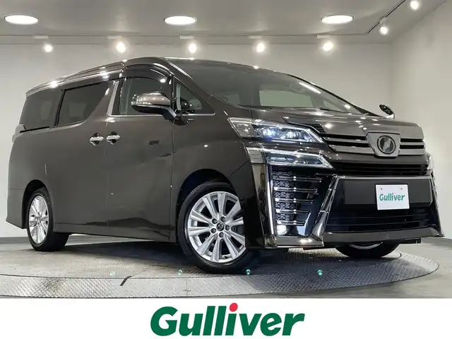 トヨタ ヴェルファイア Z 愛知県 2018(平30)年 4.8万km グラファイトM 純正１０．５インチナビ　/(Bluetooth/フルセグTV/CD・DVD再生/AM/FM)/TVキャンセラー/純正フリップダウンモニター　/１００Ｖ電源　/レーダークルーズコントロール　/両側電動スライドドア　/衝突軽減ブレーキ　/ビルトインＥＴＣ　/バックカメラ　/ＨＤＭＩ　/オットマン　/レーンアシスト/オートハイビーム/スマートキー