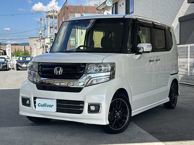 ホンダ Ｎ ＢＯＸ 2トーン カスタム ターボSSパッケージ 京都府 2017(平29)年 7.5万km プレミアムホワイトパールⅡ ケンウッドナビ/　(MDV-D304)　/ワンセグＴＶ　/CTBA/禁煙車　/両側電動スライドドア/バックカメラ　/ターボ　/クルーズコントロール/パドルシフト　/スマートキー　/ハーフレザー　/前席シートヒーター　/純正ＡＷ１５インチ　/ウィンカーミラー　/電格ミラー/純正ビルトインETC/パワーステアリング/パワーウィンドウ/AAC/CD再生機能/USB/AUX/リアスポイラー/横滑り防止/オートライト/フォグランプ/Wサイドエアバッグ/カーテンエアバッグ