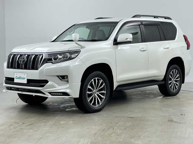 トヨタ ランドクルーザー プラド TX Lパッケージ 道央・札幌 2021(令3)年 3万km ホワイトパールクリスタルシャイン ・4WD/・寒冷地仕様/・社外ナビ/　CD/DVD/BT/USB/・フルセグTV/・バックカメラ/・後席モニター/・アダプティブクルーズコントロール/・TRD前後エアロ/・リアスポイラー/・サイドステップ/・前席パワーシート/・前席シートヒーター/・前席ベンチレーション/・電動格納サードシート/・純正エンジンスターター/・純正前後ドライブレコーダー/・レーンディパーチャーアシスト/・衝突軽減ブレーキ/・オートマチックハイビーム/・オートライト/・LEDヘッドライト/・フォグランプ/・リアフォグランプ/・ワイパーデアイサー/・19インチ純正アルミホイール/・ルーフレール/・ビルトインETC/・スペアキー/・保証書