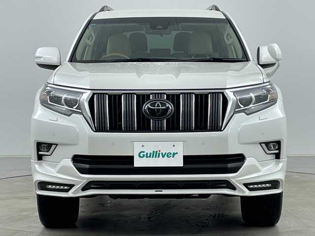 トヨタ ランドクルーザー プラド TX Lパッケージ 道央・札幌 2021(令3)年 3万km ホワイトパールクリスタルシャイン ・4WD/・寒冷地仕様/・社外ナビ/　CD/DVD/BT/USB/・フルセグTV/・バックカメラ/・後席モニター/・アダプティブクルーズコントロール/・TRD前後エアロ/・リアスポイラー/・サイドステップ/・前席パワーシート/・前席シートヒーター/・前席ベンチレーション/・電動格納サードシート/・純正エンジンスターター/・純正前後ドライブレコーダー/・レーンディパーチャーアシスト/・衝突軽減ブレーキ/・オートマチックハイビーム/・オートライト/・LEDヘッドライト/・フォグランプ/・リアフォグランプ/・ワイパーデアイサー/・19インチ純正アルミホイール/・ルーフレール/・ビルトインETC/・スペアキー/・保証書