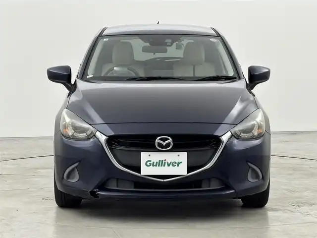 マツダ デミオ 13S Lパッケージ 福岡県 2014(平26)年 6万km ディープクリスタルブルーマイカ 純正ＳＤナビ　/ＥＴＣ　/前方ドライブレコーダー　/衝突被害軽減システム　/横滑り防止　/アイドリングストップ　/アクセル踏み間違い防止　/ＨＵＤ/レザーシート　/純正１５インチＡＷ　/純正フロアマット　/オートライト