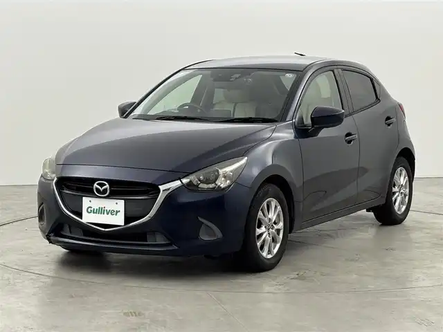 マツダ デミオ 13S Lパッケージ 福岡県 2014(平26)年 6万km ディープクリスタルブルーマイカ 純正ＳＤナビ　/ＥＴＣ　/前方ドライブレコーダー　/衝突被害軽減システム　/横滑り防止　/アイドリングストップ　/アクセル踏み間違い防止　/ＨＵＤ/レザーシート　/純正１５インチＡＷ　/純正フロアマット　/オートライト