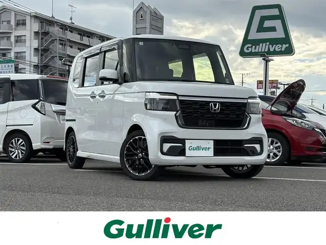 ホンダ Ｎ ＢＯＸ カスタム ターボ 大分県 2025(令7)年 0.2万km プラチナホワイトパール ・ナビ(BT/USB)/・フルセグテレビ/・バックカメラ/・両側パワースライドドア/・衝突軽減ブレーキ/・レーダークルーズコントロール/・コーナーセンサー/・ドライブレコーダー/・ETC/・シートヒーター/・ブレーキホールド/・パドルシフト/・ステアリングリモコン/・純正ホイール