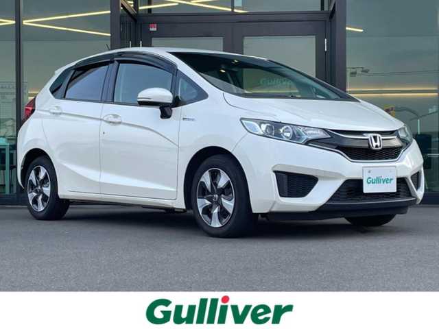 ホンダ フィット ハイブリット Lパッケージ 東京都 2016(平28)年 6.2万km プレミアムホワイトパールⅡ 純正ナビ(VXM-174VFi)/【DVD/CD/FM/AM/TV/ipod/SD/BT/USB】/バックカメラ/ビルトインETC/クルーズコントロール/あんしんパッケージ/・シティブレーキアクティブシステム/・サイドカーテンエアバックシステム/・前席用サイドエアバックシステム/ハーフレザーシート/LEDヘッドライト/本革巻きステアリング/プッシュスタート/スマートキー/スペアキー×１