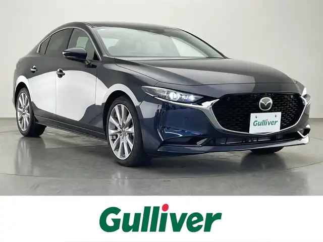 マツダ マツダ３セダン 20S Lパッケージ 愛知県 2021(令3)年 2.4万km ディープクリスタルブルーマイカ 純正ナビ　白革　シートヒーター　禁煙　フルセグＴＶ　全方位カメラ　ＤＶＤ　純正前後ドラレコ　ＥＴＣ　３６０°セーフティパッケージ　衝突軽減装置　追従クルコン　ＨＵＤ　パドルシフト　ＬＥＤオートライト　パーキングセンサー　