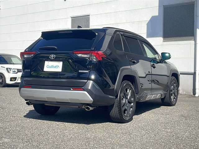 トヨタ ＲＡＶ４ アドベンチャー 福井県 2022(令4)年 2.1万km アティチュードブラックマイカ 登録時走行距離２０４７９ｋｍ/パノラマルーフ/純正ディスプレイオーディオ/JAOSエアロ/（フロント/サイド/リア）/プリクラッシュセーフティ/レーンキープアシスト/アダプティブクルーズコントロール/ブラインドスポットモニター/デジタルインナーミラー/D席パワーシート/（シートメモリ付き）/シートヒーター/エアーシート/ハーフレザーシート/オートトラミラー/オートハイビーム/オートライト/純正１９インチアルミホイール/クリアランスソナー/ルーフレール/LEDヘッドライト/LEDフォグランプ/ステリングヒーター/USBポート/ドライブレコーダー/プッシュスタート/スマートキー/保証書/取扱説明書