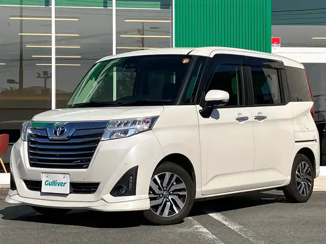 トヨタ ルーミー カスタムG 静岡県 2020(令2)年 5.1万km パールホワイトⅢ 純正ナビ(Cd/DVD/BT/フルセグ)/全方位カメラ/ETC2.0/D席N席シートヒーター/エンジンスタートボタン/両側パワースライドドア/パワーステアリング/パワーウィンドウ/アイドリングストップ/オートエアコン/スマートキー/スペアキー１本/クルーズコントロール/純正フロアマット/ウォークスルー/布シート/純正アルミホイール/ABS/横滑り防止装置/コーナーセンサー前後/レーンキープアシスト/オートライト/オートマチックハイビーム/LEDヘッドライト/Wエアバッグ/衝突軽減システム