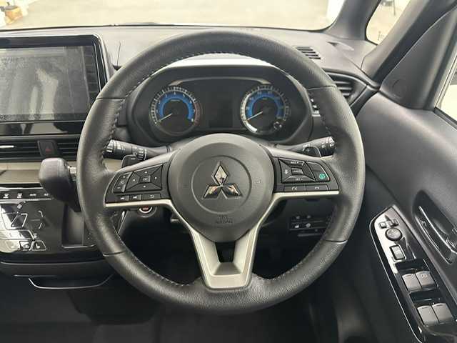 三菱 デリカミニ T プレミアム 兵庫県 2024(令6)年 0.1千km アメジストブラック/シルキーホワイト 登録時走行距離:14km/純正9型ディスプレイオーディオ（AM/FM/BT/USB）/全方位カメラ/デジタルインナーミラー/両側パワースライドドア/ハーフレザーシート/シートヒーター/ハンドルヒーター/衝突被害軽減システム/レーダークルーズコントロール/レーンキープアシスト/コーナーセンサー/横滑り防止装置/アイドリングストップ/ダウンヒルアシストコントロール/サイドデカール/オートLEDライト/純正アルミホイール/オートホールド付電子パーキング/革巻きステアリング/ステアリングスイッチ/スマートキー/スペアキー