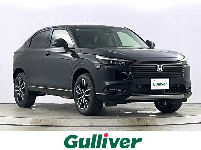 ホンダ ヴェゼル ハイブリッド e:HEV Z 愛知県 2025(令7)年 0.1万km未満 クリスタルブラックパール 登録済未使用車/純正9型メモリナビ/（フルセグTV/Ｂｌｕｅｔｏｏtｈ//AppleCarPlay/AndroidAuto/FM)/バックカメラ/置くだけ充電/シーケンシャルウインカー/ビルトインＥＴＣ２．０/衝突軽減ブレーキ/レーンキープアシスト/レーダークルーズコントロール/ブラインドスポットモニター/ステアリングヒーター/パドルシフト/革巻きステアリング/パワーバックドア/シートヒーター/純正アルミホイール/LEDヘッドライト/フロントフォグライト/ダウンヒルアシスト/スマートキー/プッシュスタート/クリアランスソナー/横滑り防止装置