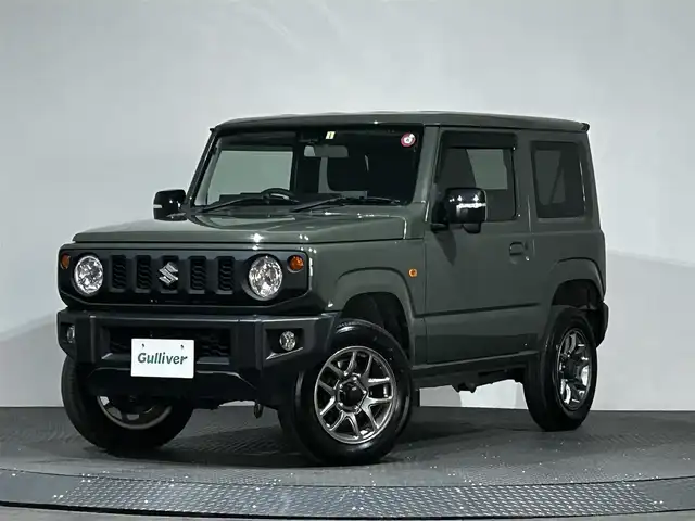 スズキ ジムニー XC 愛媛県 2023(令5)年 0.9万km ジャングルグリーン ワンオーナー　純正SDナビ　Bluetooth　CD　DVD　バックカメラ　スズキセーフティサポート　アイドリングストップ　純正アルミホイール　シートヒーター　ステアリングリモコン　ドアバイザー　プッシュスタート　スマートキー　スペアキー