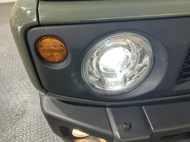 スズキ ジムニー XC 愛媛県 2023(令5)年 0.9万km ジャングルグリーン ワンオーナー　純正SDナビ　Bluetooth　CD　DVD　バックカメラ　スズキセーフティサポート　アイドリングストップ　純正アルミホイール　シートヒーター　ステアリングリモコン　ドアバイザー　プッシュスタート　スマートキー　スペアキー