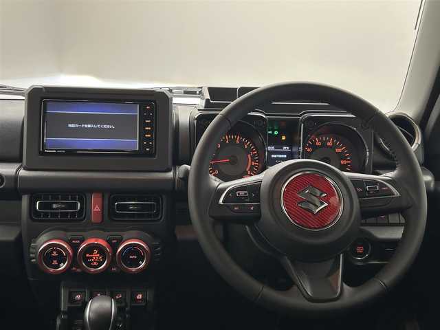 スズキ ジムニー XC 愛媛県 2023(令5)年 0.9万km ジャングルグリーン ワンオーナー　純正SDナビ　Bluetooth　CD　DVD　バックカメラ　スズキセーフティサポート　アイドリングストップ　純正アルミホイール　シートヒーター　ステアリングリモコン　ドアバイザー　プッシュスタート　スマートキー　スペアキー