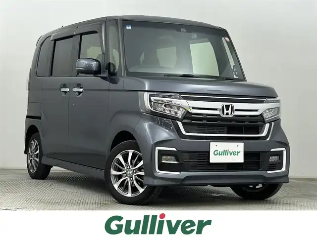 ホンダ Ｎ ＢＯＸ カスタム L 道央・札幌 2022(令4)年 2.4万km メテオロイドグレーメタリック ・４WD/・寒冷地仕様/・社外メモリーナビ/　CD/DVD/SD/BT/フルセグ/・バックカメラ/・前後ドライブレコーダー/・ホンダセンシング/・クルーズコントロール/・レーンキープアシスト/・クリアランスソナー/・左側パワースライドドア/・前席シートヒーター/・ミラーヒーター/・純正LEDヘッドライト/・フォグライト/・オートライト/・プッシュスタート/・スマートキー/・一体型エンジンスターター/・純正フロアマット/・ドアバイザー