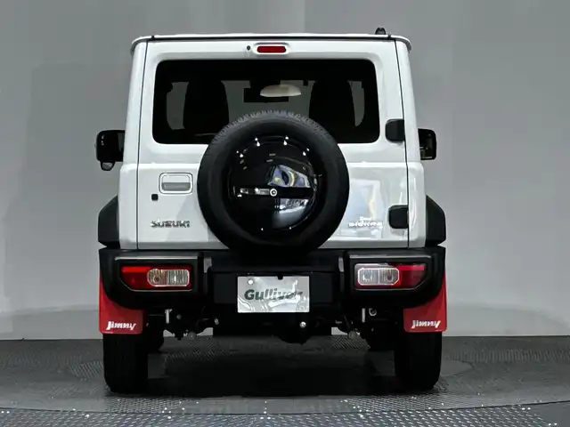 スズキ ジムニー シエラ JC 愛媛県 2023(令5)年 1.4万km ピュアホワイトP ・８型ナビ（フルセグＴＶ・ＢＴ・ＦＭＡＭ・ＳＤ）/・バックカメラ　/・２ＷＤ・４ＷＤ切り替え/・ＥＴＣ　/・ＤＮ席シートヒーター　/・ダウンヒルアシストコントロール　/・クルーズコントロール　/・衝突軽減ブレーキ/・ヘッドライトウォッシャー/・純正マッドフラップ