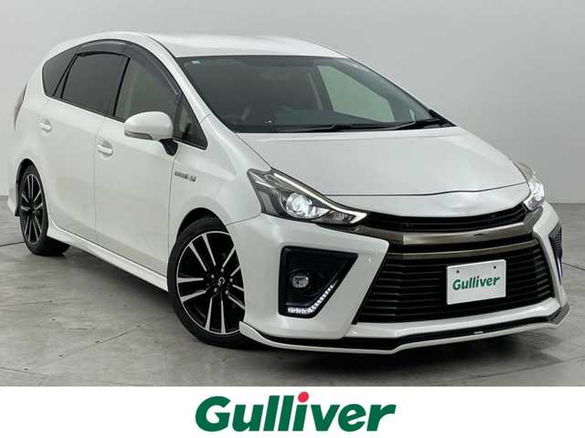 トヨタ プリウス α S ツーリングセレクション G’s 福岡県 2016(平28)年 6.3万km ホワイトパールクリスタルシャイン シルクブレイズエアロ　/後席モニター　/アルパインナビ（ＢＴ，フルセグＴＶ）　/バックカメラ　/ＥＴＣ　/前方ドライブレコーダー　/ハーフレザーシート　/ステアリングリモコン　/純正フロアマット　/純正１８インチＡＷ