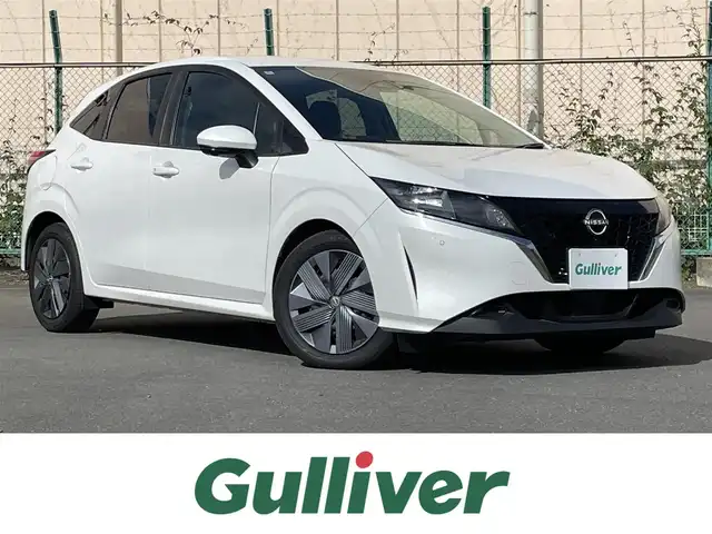 日産 ノート X 東京都 2022(令4)年 5.1万km ピュアホワイトパール 発注不可車両/純正ナビ/・フルセグ/AM/FM/USB/全方位カメラ/インテリジェントルームミラー/アダプティブクルーズコントロール（プロパイロット）/ハンドル支援/駐車支援/側方支援/後側方支援/ドライブモード/ワイヤレス充電器/ＥＴＣ/純正フロアマット/リアスポイラー/プッシュスタート/スマートキー/ステアリングスイッチ