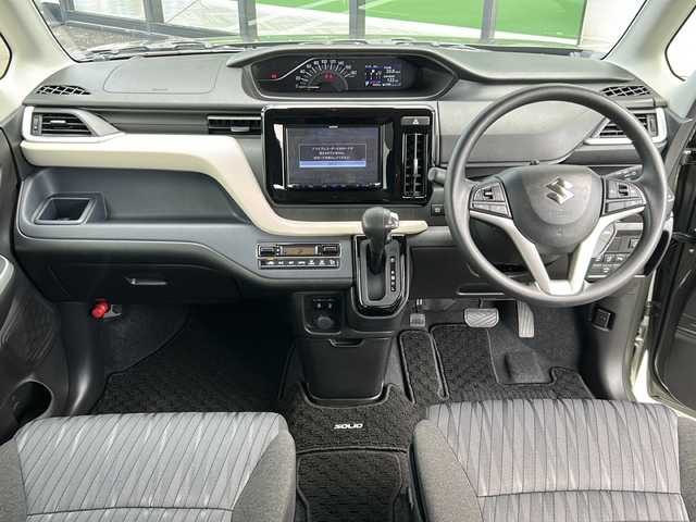 スズキ ソリオ HV MX 岐阜県 2023(令5)年 0.9万km タフカーキパールメタリック 登録時走行距離9039km/純正８型メモリーナビ/Bluetoothオーディオ/フルセグＴＶ/バックカメラ/片側パワースライドドア/禁煙車/レーダークルーズコントロール/レーンキープアシスト/前方ドライブレコーダー/後方コーナーセンサー/シートヒーター/純正15インチアルミホイール/オートライト/ETC/USB充電ポート/純正フロアマット/プッシュスタート/スマートキー/スペアキー/ドアバイザー